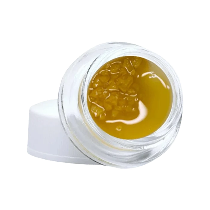 Close-up of the Gelato #33 Diamonds & Terp Sauce with a golden, viscous texture visible within a clear container.