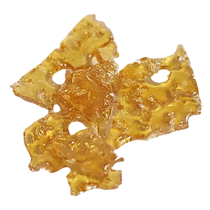 A close-up, overhead view of the golden Grape Animal Shatter 2.0, showing its fragmented, crystalline texture.