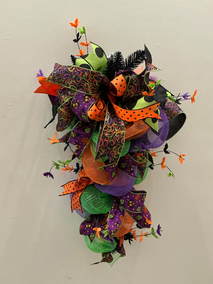 Handmade Halloween teardrop door hanger with bats and ribbon