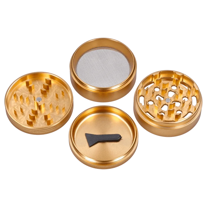 A top-down view of the disassembled Hue 3-Stage Grinder in champagne gold, showcasing its multi-tiered design and metallic finish.