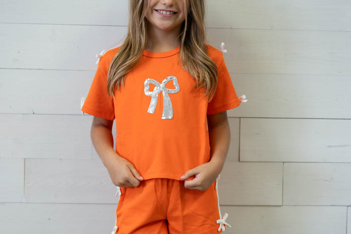 Orange Top with Sequin Bow