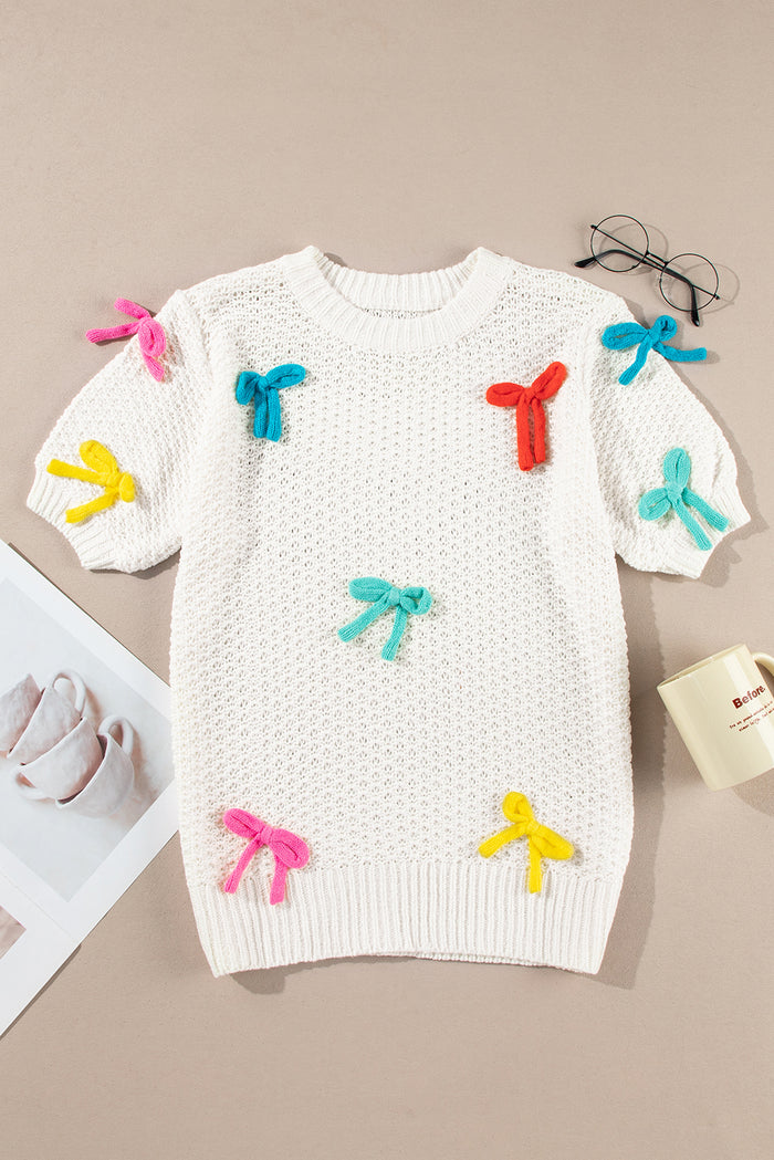 Pull blanc à manches courtes et col montant en tricot avec nœud coloré