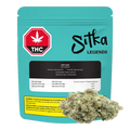 Front view of a teal Sitka Legends Ruby Haze pouch standing upright with a black label and a close-up of a light green cannabis bud at the lower right.
