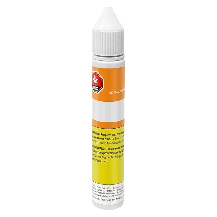 Close-up of THC Dissolving Drops packaging with French text, displaying a warning label against a light background.