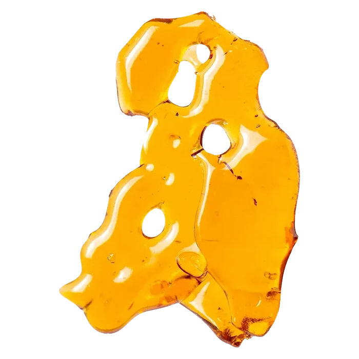 Close-up view of the golden-toned White Widow Shatter, displayed with an abstract, crystalline texture against a stark white background.